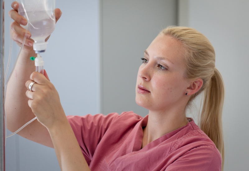 female-medical-assistant-is-preparing-an-infusion